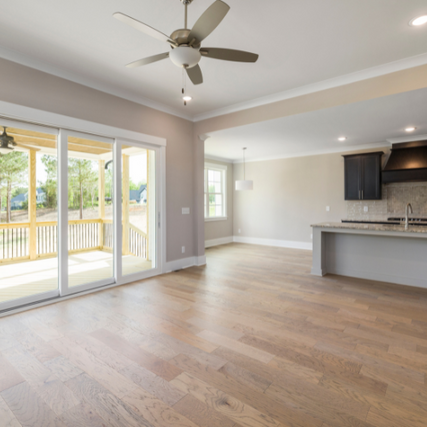 FlooringA light wood laminate floor inside of an empty home.
